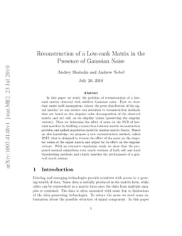 Reconstruction of a Low-rank Matrix in the Presence of Gaussian Noise